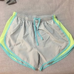 Gray with blue and lime green Nike shorts